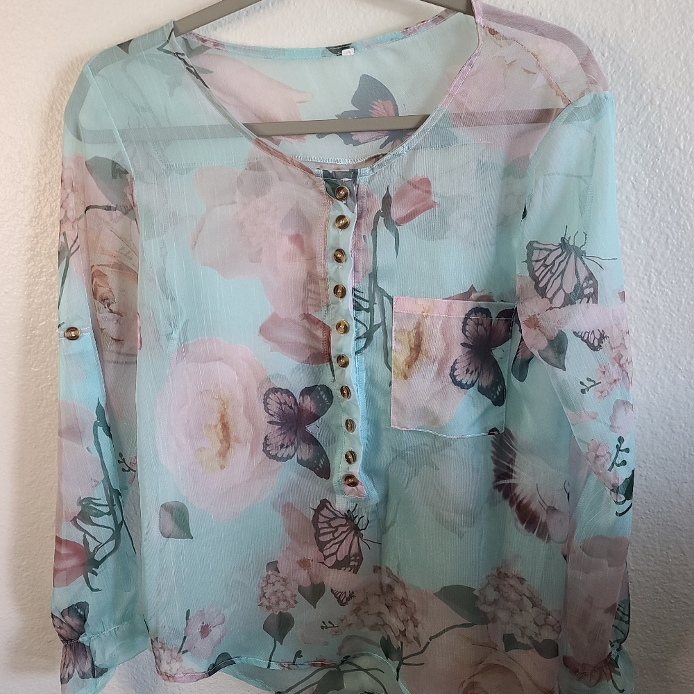 Woman's sheer blue and pink floral shirt